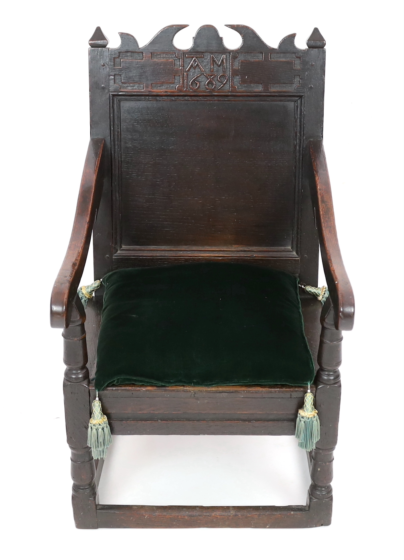 A Charles II oak armchair, of small proportions, monogrammed AM and dated 1682